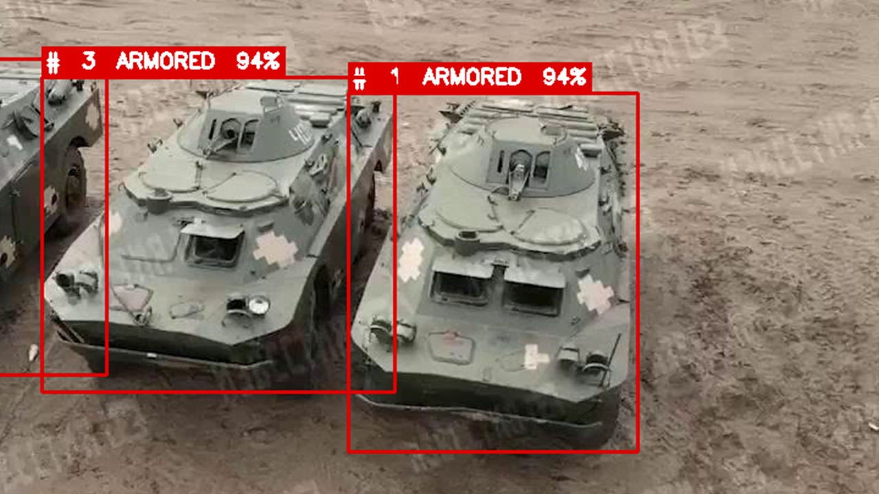 Aerial view with AI detection overlays on armored vehicles